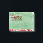 Merry ChrisMUSH Cartoon Mushrooms Post-it Notes<br><div class="desc">Use these cute cartoon mushroom caps (wearing caps) for fun holiday notes. Text (that can be customized) reads: Merry ChrisMUSH! These have a textured watercolor pattern in green on the paper and a candy cane narrow border on the bottom in red and white. Spread the cheer! Happy Holidays!</div>