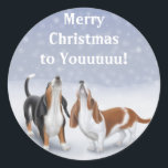 Merry Christmas Basset Hounds Classic Round Sticker<br><div class="desc">Original fine art design of howling Basset hounds in the snow by illustrator Carolyn McFann on quality greeting cards,  invitations and stationery for dog lovers.</div>
