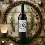 Merry Christmas Berry Leaves Wreath Wine Label<br><div class="desc">Raise your glasses this holiday season with a touch of bespoke elegance. Introducing our personalized Christmas wine label, a perfect blend of artistry and festive spirit. The label is adorned with a gracefully painted watercolor Christmas wreath, capturing the essence of holiday warmth and merriment. At its core, the phrase “Merry...</div>