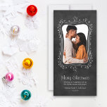 Merry Christmas Black Chalkboard Couple Photo Holiday Card<br><div class="desc">Share “Merry Christmas” with this modern holiday card featuring your favorite photo inside a hand-drawn chalk frame. A black chalkboard-textured background with whimsical doodles and stars creates a cozy,  romantic look for couples. Customize the names and year to make it uniquely yours.</div>