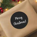 Merry Christmas Black & White Typography Classic Round Sticker<br><div class="desc">Cool and stylish black and white Merry Christmas design. This design has the festive message “Merry Christmas!” In modern white typography text on a black background. Perfect for envelope seals or for the finishing touch to your gifts or favour bags. If you wish to change the message you can do...</div>