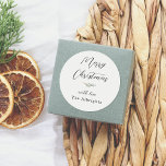 Merry Christmas Calligraphy & Family Name Pine Classic Round Sticker<br><div class="desc">A personalized Christmas sticker featuring elegant typography and a watercolor pine sprig. At the top of the sticker, 'Merry Christmas' is written in elegant script lettering, followed by the pine branch. Underneath, your family name is signed 'with love'. Ideal for sealing envelopes, decorating gift boxes, or embellishing festive items! Made...</div>