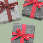 Merry Christmas Calligraphy Silver Snowflakes Wrapping Paper Sheet<br><div class="desc">This design features a merry Christmas calligraphy script wrapping paper merry Christmas calligraphy script, a simple silver snowflakes snow, silver calligraphy stylish trendy font, minimalist pattern winter design, winter silver grey grey white, Christmas holiday wrapping supplies, custom customized personalized gift wrap, simplistic elegant classic classy cute, cute creative typography style...</div>