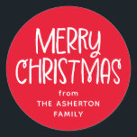 Merry Christmas cute fun red family name Classic Round Sticker<br><div class="desc">This fun festive Christmas sticker features a playful Merry Christmas in white on red and room for your custom text. You can personalize this cute holiday gift sticker with who the gift is from or another message. Find more matching cards, gift wrap and more in a variety of colours and...</div>