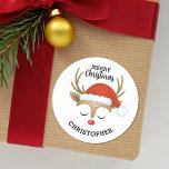 Merry Christmas Cute Kids Reindeer  Classic Round Sticker<br><div class="desc">A cute reindeer face with a santa hat decorates this sticker with the words Merry Christmas. Fun for decorating Christmas gifts and holiday treat bags for neighbours. Personalize it with your name. Designed for you by Blackberry Boulevard.</div>