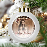 Merry Christmas Family Photo Rose Gold Script Ceramic Ball Christmas Ornament<br><div class="desc">Spread holiday cheer to friends and family with this modern keepsake ornament. The rose gold faux foil text reads "Merry Christmas" in elegant handwriting script. Replace the sample image with your favourite photo,  and add your family name and the year. A white gradient filter helps make the text pop.</div>