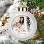 Merry Christmas Family Photo Rose Gold Script Ceramic Ball Christmas Ornament<br><div class="desc">Spread holiday cheer to friends and family with this modern keepsake ornament. The rose gold faux foil text reads "Merry Christmas" in elegant handwriting script. Replace the sample image with your favourite photo,  and add your family name and the year. A white gradient filter helps make the text pop.</div>