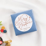Merry Christmas Flourish Lettering Family Name Classic Round Sticker<br><div class="desc">An elegant Christmas sticker design, with "Merry Christmas" hand-lettered in chic script calligraphy with beautiful flourishes. Below, your family name and the year appear in classic serif typography. Ideal for sealing envelopes, decorating gift boxes, or embellishing festive items! Made to match our Joyful Flourish Modern Minimal Photo Christmas Holiday Collection,...</div>