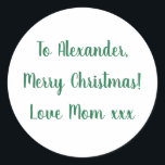Merry Christmas from Mom green minimal Classic Round Sticker<br><div class="desc">This is a minimal Christmas gift tag label in festive green and white. It has the message Merry Christmas Love Mom xxx in stylish typography script. To personalize, simply change the name Alexander to your loved one's name in the personalize this text box. Want to make more changes? All of...</div>
