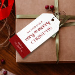 Merry Christmas Gift Tags Classic Red Typography<br><div class="desc">Complete your holiday packaging and gift wrapping with a personalised modern Merry Christmas gift tags. This Typography Holiday tag includes a modern heart swirl font with space for your family surname. This gift tag in red and white brings a classic festive theme and is the perfect finishing touch to your...</div>