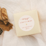 Merry Christmas & Gold Heart Cream Holiday Classic Round Sticker<br><div class="desc">Merry Christmas & Gold Heart Cream Holiday Round Stickers! These minimalist stickers feature a "merry christmas" greeting at the top of the card, with "merry" written in elegant script calligraphy, adorned with simple flourishes at either end. Below, there is a cute gold heart. With your family name and the year...</div>
