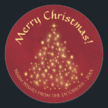 Merry Christmas! Golden Lights Tree on Crimson Red Classic Round Sticker<br><div class="desc">These beautiful Christmas stickers feature a beautiful design that is at once traditional and modern. There is a Christmas tree made completely of gold lights on a marbled crimson red background. The caption reads Merry Christmas, and there is space below for a short note or signature. Perfect as envelope seals...</div>