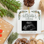 Merry Christmas Grandma Ultrasound Photo Ceramic Ornament<br><div class="desc">Capture the joy of the holiday season and celebrate a special announcement with our Personalized Christmas Tree Ceramic Ornament. This enchanting ornament is a perfect blend of festive charm and heartfelt sentiment. Front of the Ornament: Background: A pristine white canvas provides the backdrop for a beautifully adorned Christmas tree. Two...</div>