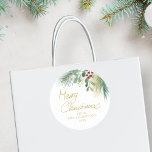 Merry Christmas Greenery Classic Round Sticker<br><div class="desc">This festive sticker is decorated with red,  green,  and gold watercolor foliage and says Merry Christmas in script typography. 
Easily customizable. 
Original Watercolor © Michele Davies.</div>