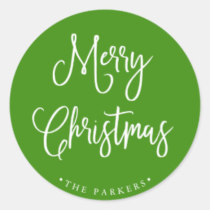 Merry Christmas Handwritten Script on Green Classic Round Sticker