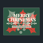 Merry Christmas Holly Typography Holiday Postcard<br><div class="desc">"Merry Christmas from Our Home to Yours",  with soft cream typography,  red and green holly leaves and berries overlapping each other,  and a decorative design element,  on a green background. Warm,  nostalgic,  and classic holiday greeting in strong serif typography.</div>