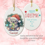 Merry Christmas Koala Bear Kids Christmas Ceramic Ornament<br><div class="desc">On the front of this cute keepsake ceramic ornament for a child is an adorable little koala bear wearing a Santa hat. He holds a Holiday tree decoration, and is surrounded by soft evergreen. Your child's name is at the bottom. The back of the ornament has a Merry Christmas message...</div>