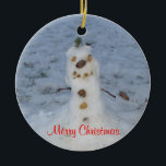 Merry Christmas Little Snowman Year Ceramic Ornament<br><div class="desc">Cute little nature snowman with pine cone nose,  pebble rocks for eyes,  smile and buttons,  branches for arms,  and a green bush topper for his hat.  Merry Christmas. is written in red script.  Backside has  snowman and area to insert Current Year.  Original Photography by TamiraZDesigns.</div>