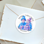 Merry Christmas Personalized Watercolor Classic Round Sticker<br><div class="desc">Pretty watercolor Christmas personalized holiday stickers. Merry Christmas with your Family Name. Two cute vintage kids,  a boy and girl,  brother and sister holding gift boxes in blue and pink winter hats.</div>