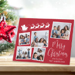 Merry Christmas Photo Collage Santa Sleigh Holiday Card<br><div class="desc">Festive red holiday folded card with a 5 photo collage of scattered pictures in white frames, a white illustration of reindeers flying Santa's sleigh, "Merry Christmas" in a stylish white script and your name in simple modern white typography. Customize your greeting on the inside or leave blank for handwritten notes....</div>