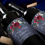 Merry Christmas red floral navy barn family name Wine Label<br><div class="desc">Celebrate this Christmas with an elegant personalized labelled wine with your custom text featuring a traditional seasonal bouquet with red and white peonies,  fir boughs,  and green foliage over a rustic country navy barn wood with string lights.</div>