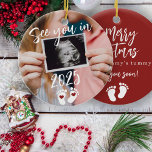 Merry Christmas see you in 2025 photo pregnancy Ceramic Ornament<br><div class="desc">Modern funny see you in 2025 script,  footprints,  and red hearts new baby expecting parents keepsake Merry Christmas from mommy's tummy red tree ornament with your custom ultrasound photo.</div>