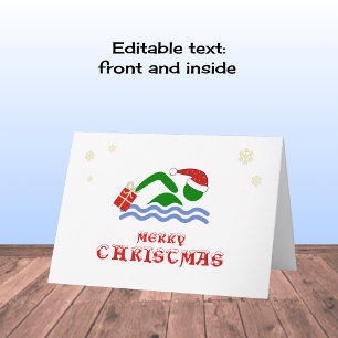 Merry christmas swimmer bringing gift holiday card