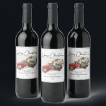 Merry Christmas Vintage Red Truck Family Holiday  Wine Label<br><div class="desc">Merry Christmas Vintage Red Truck Family Holiday Wine Labels - feature a red vintage truck filled with Christmas botanicals, holly berries and a black and white bow on a white weathered wood background. Merry Christmas is in a pretty script font. Label is personalized with your family name. Labels are part...</div>