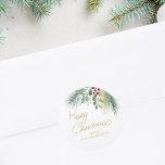 Merry Christmas Watercolor Greenery Classic Round Sticker<br><div class="desc">This festive sticker is decorated with red,  green,  and gold watercolor foliage and says Merry Christmas in script typography. 
Easily customizable. 
Original Watercolor © Michele Davies.</div>