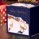 Merry Christmas - wood deers and mountains in snow Favor Box<br><div class="desc">Celebrate the season with this enchanting gift box adorned with my Fantabuloustef artwork. Featuring three wooden deer in a snowy Christmas night scene, nestled near a wooden mountain, it's a true winter wonderland. "Merry Christmas" is elegantly written in shimmering golden calligraphy, adding a touch of festive magic. Perfect for bringing...</div>