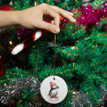 Merry Puffin Ceramic Ornament<br><div class="desc">Adorn your Christmas tree with a touch of personalized winter charm with our "Merry Puffin" ceramic ornament. This delightful ornament features the adorable watercolor illustration of a puffin, bundled up for winter in a cozy red and white striped beanie topped with a fluffy pompom. This charming seabird brings a whimsical...</div>
