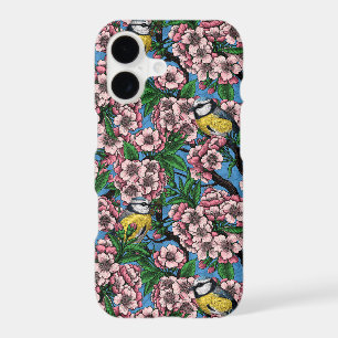 Mésanges bleues dans le cerisier en fleurs sur fon