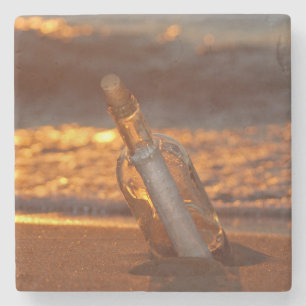 message in bottle on sunset beach stone coaster