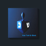 Metallic Blue Dreidel Canvas Print<br><div class="desc">A modernistic,  metallic blue dreidel against a dark,  night-like background.  Two of the Hebrew letters found on a dreidel,  nun and shin,  glow brightly.  Add your own text.</div>