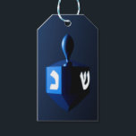 Metallic Blue Dreidel Gift Tags<br><div class="desc">A modernistic,  metallic blue dreidel against a dark,  night-like background.  Two of the Hebrew letters found on a dreidel,  nun and shin,  glow brightly.  Add your own text on the reverse side.</div>