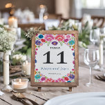 Mexican Colourful Floral Botanical Fiesta Wedding Table Number<br><div class="desc">This Mexican Colourful Floral Botanical Fiesta Wedding Table Number design bursts with vibrant, hand-drawn flowers in a variety of bright colours, including shades of pink, purple, yellow, and turquoise, which form a border around the central space. The intricate details of the petals and leaves, along with small floral accents and...</div>