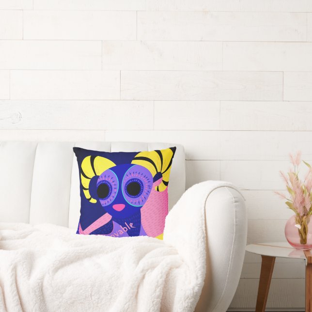 Mexican pink and blue folk art on throw pillow (Couch)