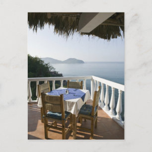 Mexico, Guerrero, Zihuatanejo. Cafe Table over Postcard