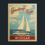 Michigan Sailboat Vintage Travel Postcard<br><div class="desc">This Greetings From Michigan vintage travel nautical design features a boat sailing on the water with seagulls and a blue sky filled with gorgeous puffy white clouds.</div>