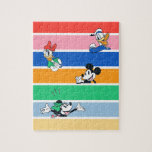 Mickey & Friends Pop-Out Colour Striped Graphic Jigsaw Puzzle<br><div class="desc">Add a pop of joy to your day with this vibrant Mickey & Friends "Peek-a-Boo" design! Featuring Mickey Mouse, Minnie, Donald, and Daisy, this high-energy graphic showcases your favourite characters popping out from behind bold, multi-coloured stripes. With its saturated colour palette and playful character expressions, this design is all about...</div>