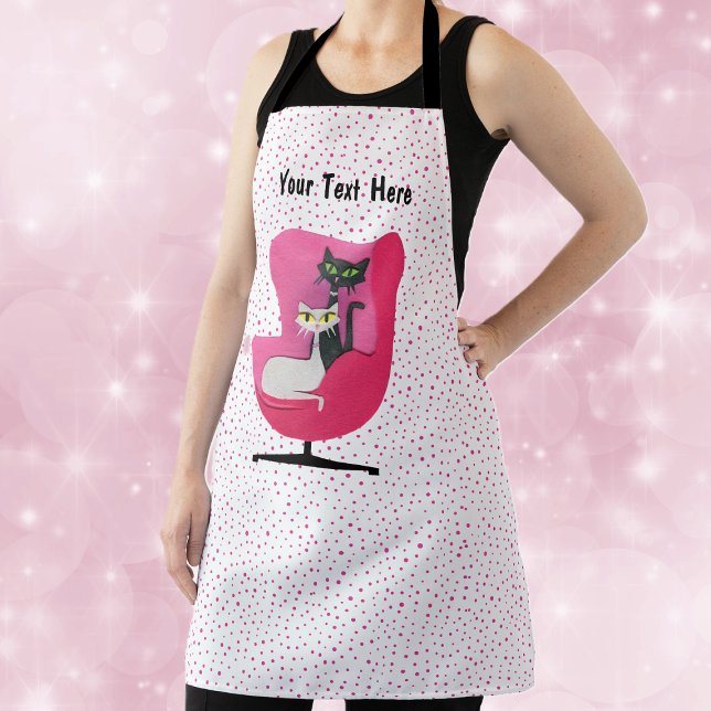 Mid Century Pink Chair With Two Cats Pink Dots Apron (Mid century elegant cats in a vintage chair on white kitchen apron with pink polka dots.)