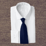 Midnight Navy Blue Solid Color Tie<br><div class="desc">Discover the elegance of Midnight Navy Blue,  a captivating deep navy blue that evokes the serene mystery of a midnight sky and the profound depths of the ocean. This sophisticated hue brings a touch of enigma and tranquility,  Perfect for adding a subtle yet impactful statement,  this color seamlessly integrates into both modern and classic aesthetics. Elevate your space with the timeless allure of this rich,  dark shade.</div>