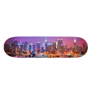 Midtown Manhattan at night with Empire Stae Skateboard