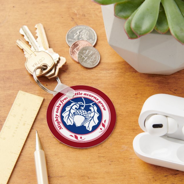 Mighty oaks from little acorns grow on deep red keychain (Desk)