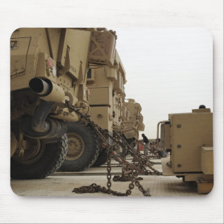 Military vehicles are locked down on semi truck mouse pad