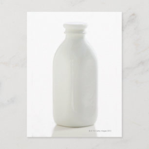 Milk bottle on white background postcard