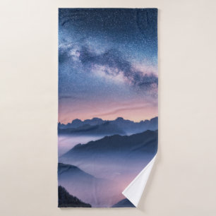 Milky Way over mountains in fog at night in summer Bath Towel