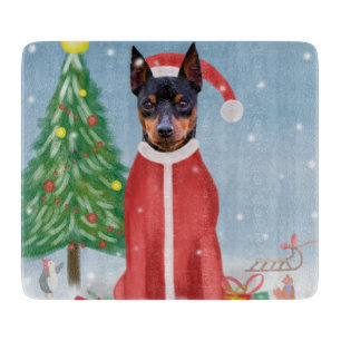Miniature Pinsch Dog in Snow with Christmas Gifts  Cutting Board