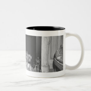 Miniature poodles sitting in front of fireplace Two-Tone coffee mug