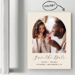 Minimal Boho Photo Arch Beige Save the Date Magnetic Invitation<br><div class="desc">This simple,  minimalist boho Save the Date magnetic card features an arch-shaped photo above the words "Save the Date" in elegant white handwriting script,  followed by the couple's names,  wedding date and city in sans serif font on a beige background.</div>